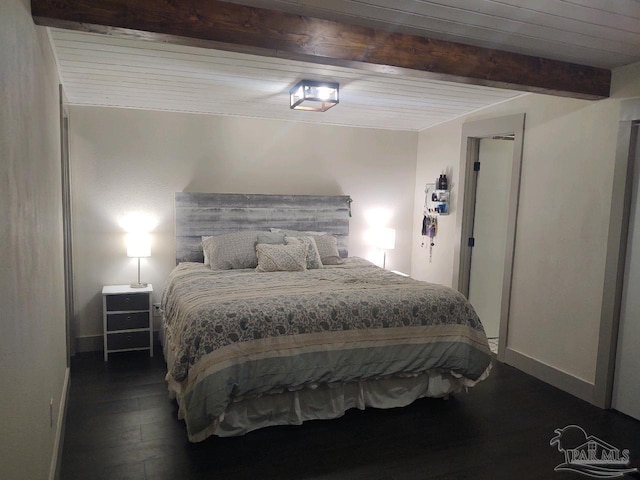 bedroom with beam ceiling and dark hardwood / wood-style flooring