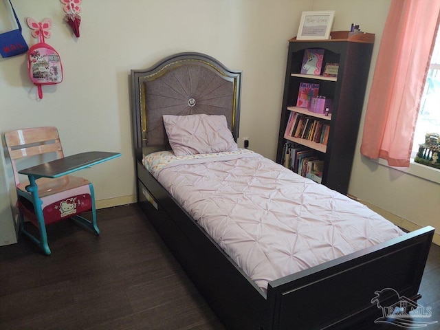 bedroom featuring dark wood-type flooring