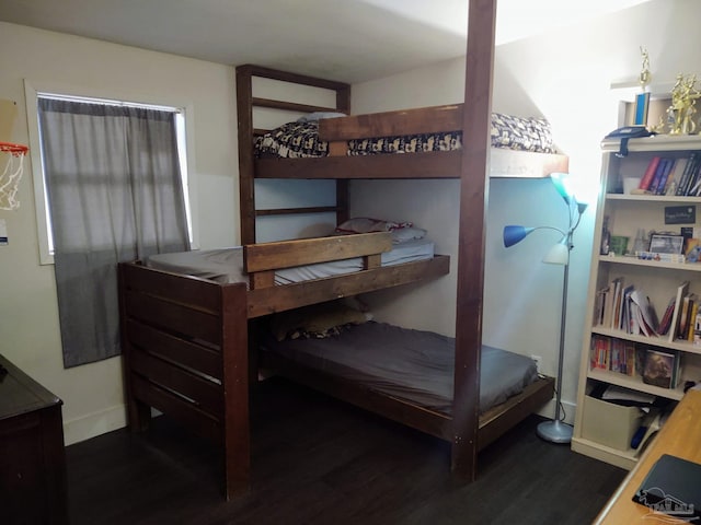 bedroom featuring dark wood-type flooring