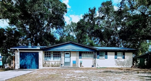 ranch-style house featuring a garage