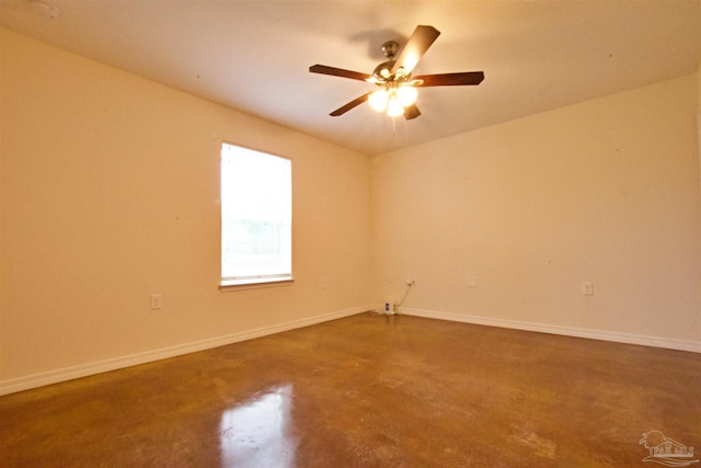 4217 Celtic Cir, Pace, FL 32571 - spare room with baseboards, finished concrete floors, and a ceiling fan