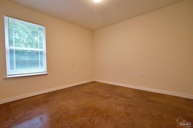 4217 Celtic Cir, Pace, FL 32571 - empty room featuring dark colored carpet and baseboards