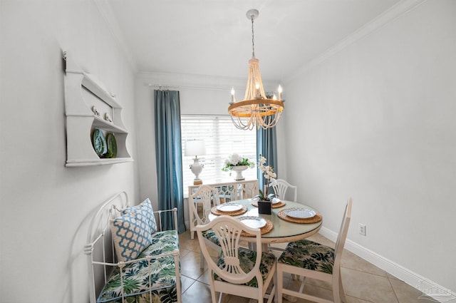 tiled dining space featuring ornamental molding and a chandelier