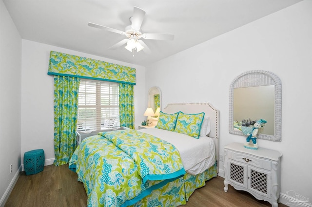 bedroom with dark wood-type flooring and ceiling fan