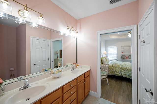 bathroom featuring hardwood / wood-style flooring, vanity, and ceiling fan