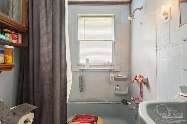 8717 Mayflower Ave, Pensacola, FL 32534 - bathroom featuring shower / bath combo and tile walls