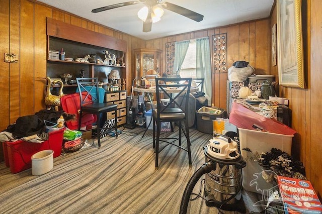 8717 Mayflower Ave, Pensacola, FL 32534 - interior space with wooden walls, ceiling fan, and carpet