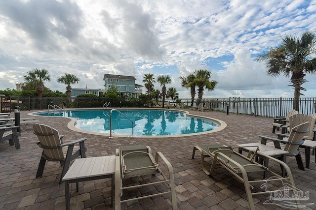 view of swimming pool featuring a patio