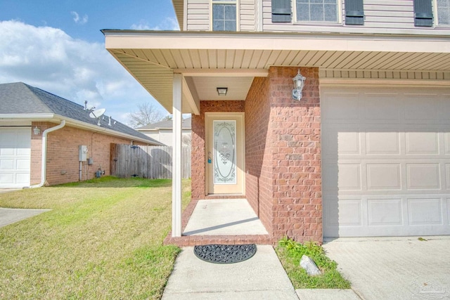 property entrance featuring a garage, brick siding, a lawn, and fence