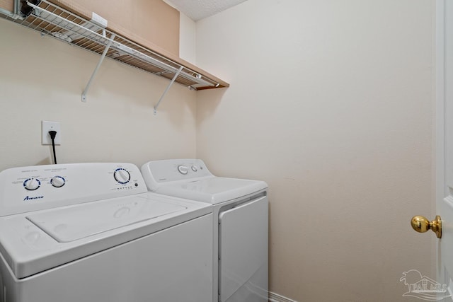 clothes washing area with laundry area and independent washer and dryer