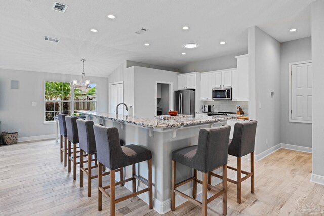 1008 Black Walnut Trl, Pensacola, FL 32514 - kitchen featuring stainless steel appliances, baseboards, backsplash, light wood-style flooring, and recessed lighting