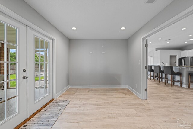 1008 Black Walnut Trl, Pensacola, FL 32514 - entryway with light wood finished floors, baseboards, recessed lighting, and french doors