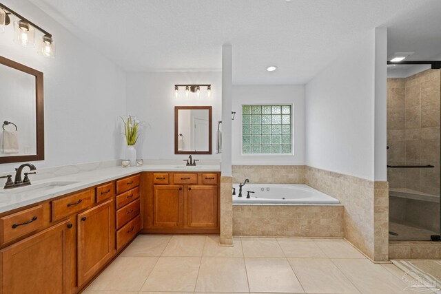 1008 Black Walnut Trl, Pensacola, FL 32514 - bathroom with a garden tub, a tile shower, double vanity, and tile patterned floors