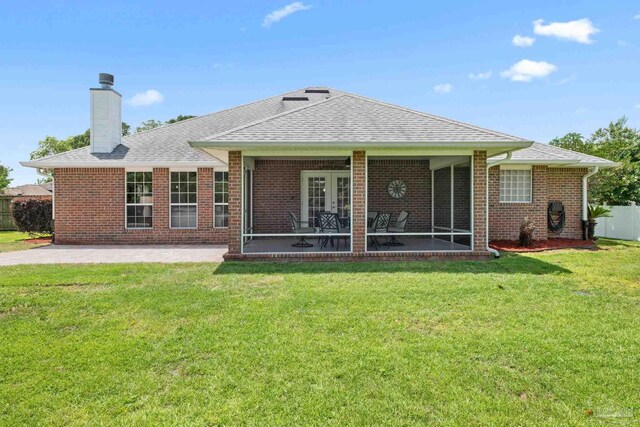1008 Black Walnut Trl, Pensacola, FL 32514 - rear view of house with a patio area, a chimney, brick siding, and roof with shingles