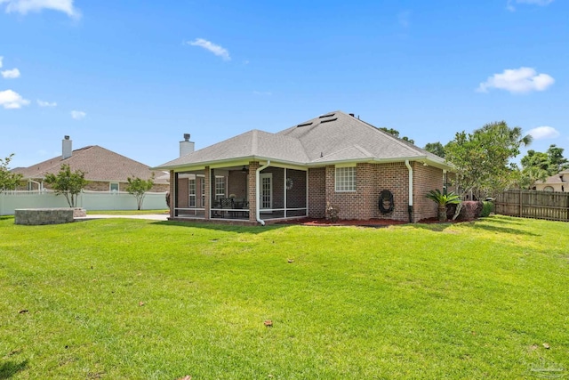1008 Black Walnut Trl, Pensacola, FL 32514 - back of house with brick siding, a sunroom, and a chimney