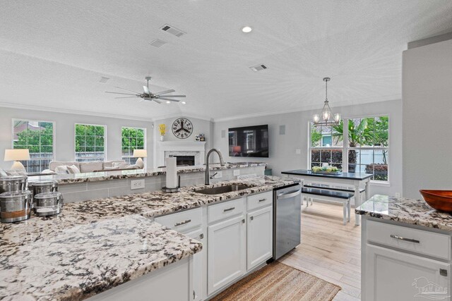 1008 Black Walnut Trl, Pensacola, FL 32514 - kitchen featuring a sink, dishwasher, open floor plan, a textured ceiling, and crown molding