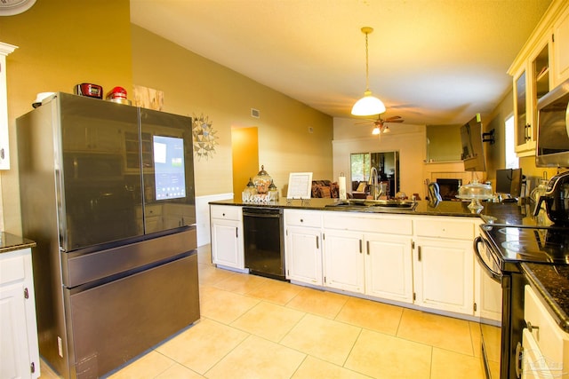 kitchen with white cabinetry, sink, black appliances, and lofted ceiling