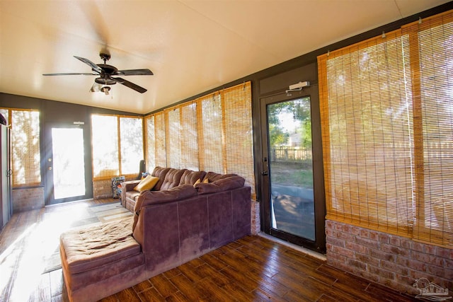 sunroom / solarium featuring ceiling fan