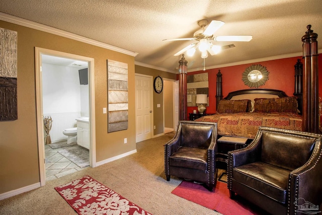 bedroom with ensuite bathroom, light colored carpet, ceiling fan, crown molding, and a textured ceiling