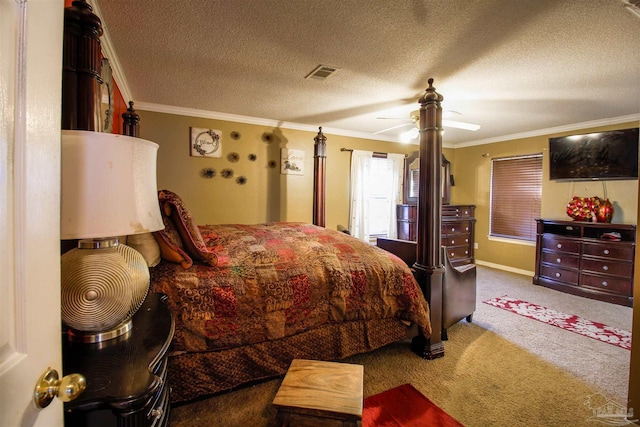 carpeted bedroom featuring ornamental molding, ceiling fan, and a textured ceiling