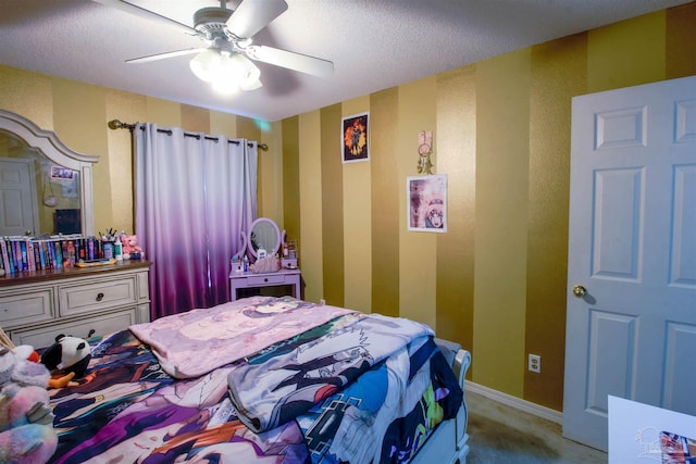 carpeted bedroom featuring a textured ceiling and ceiling fan