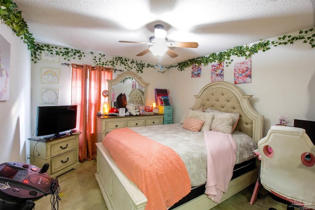 carpeted bedroom featuring a textured ceiling and ceiling fan