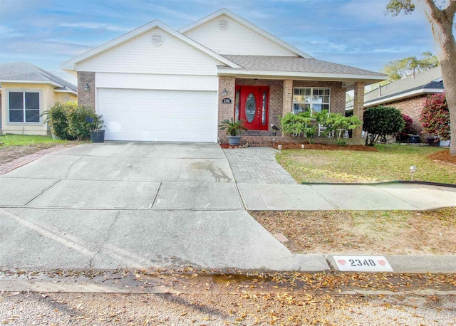 ranch-style house featuring a garage, a front lawn, and covered porch