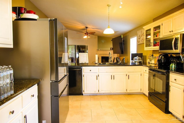 kitchen with sink, white cabinetry, ceiling fan, dark stone counters, and black appliances