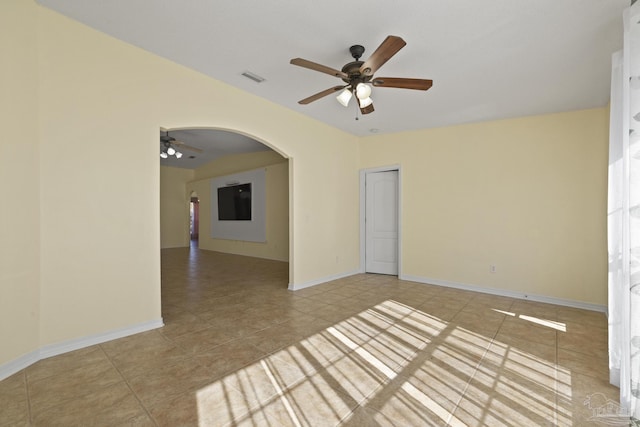 unfurnished room with ceiling fan and light tile patterned floors