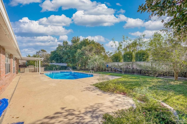 view of swimming pool with a yard, a patio, and pool water feature