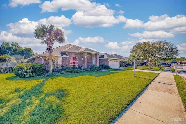 ranch-style house featuring a front yard and a garage