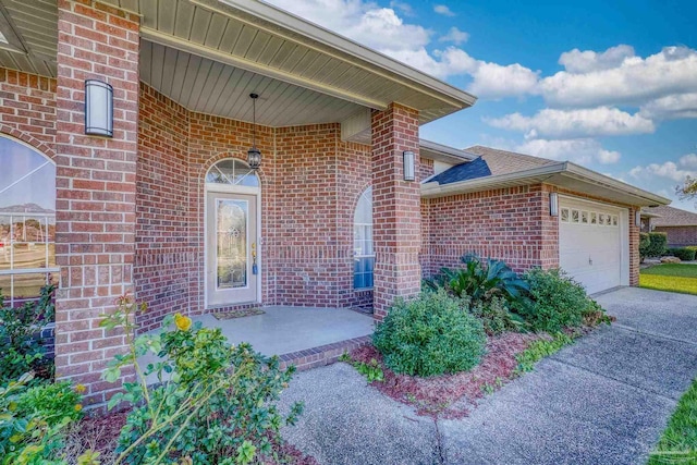 entrance to property featuring a garage