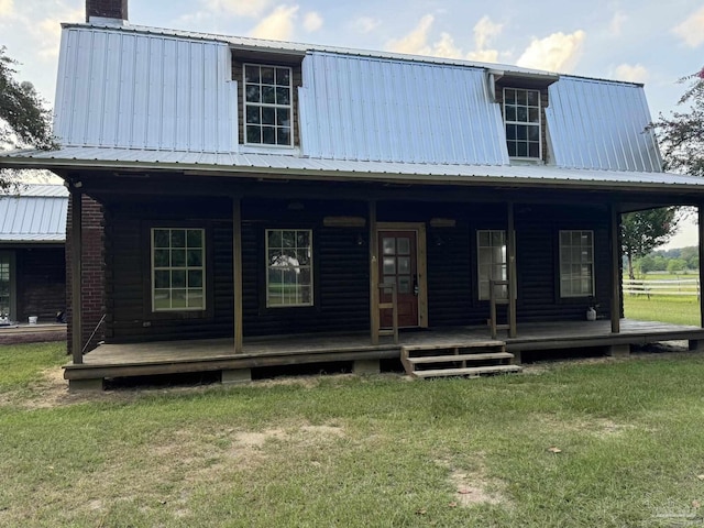 view of front of home with a porch and a front lawn