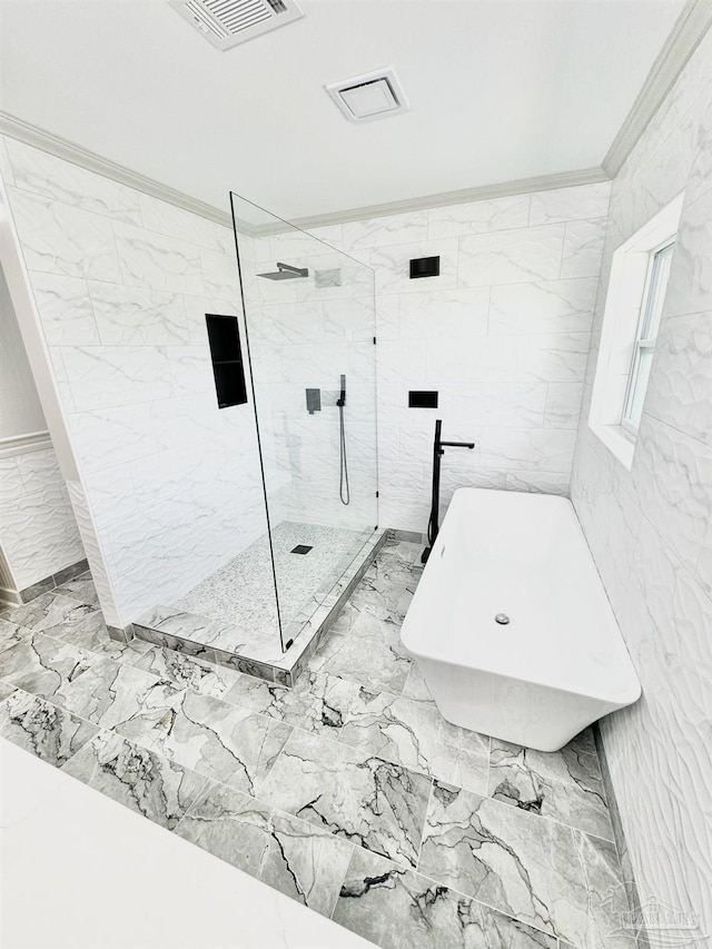 bathroom featuring independent shower and bath and ornamental molding