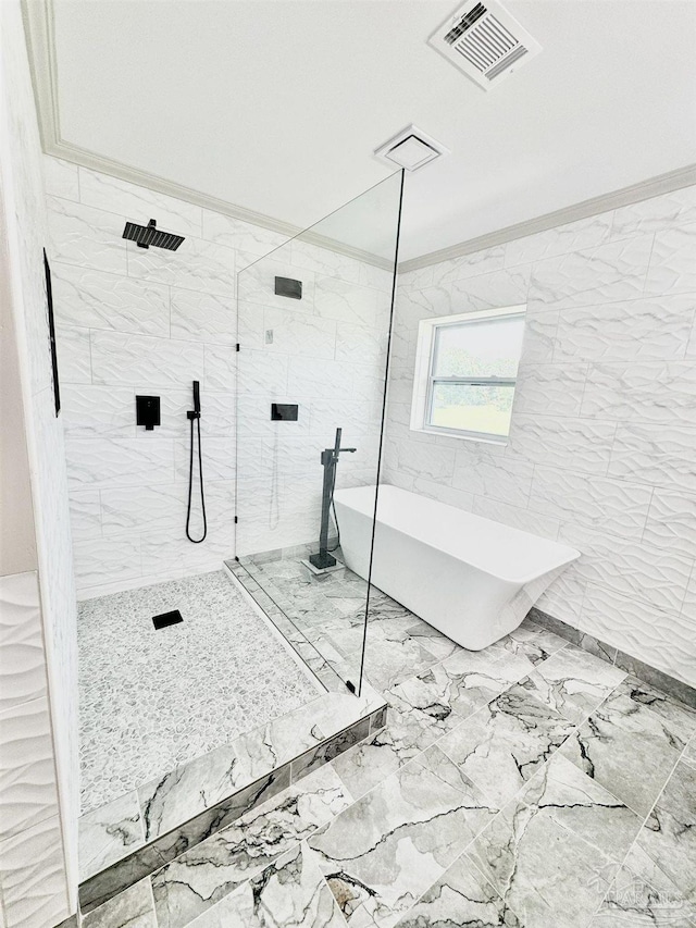 bathroom with crown molding and shower with separate bathtub