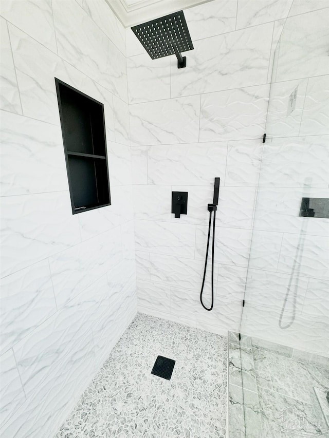 bathroom with tiled shower