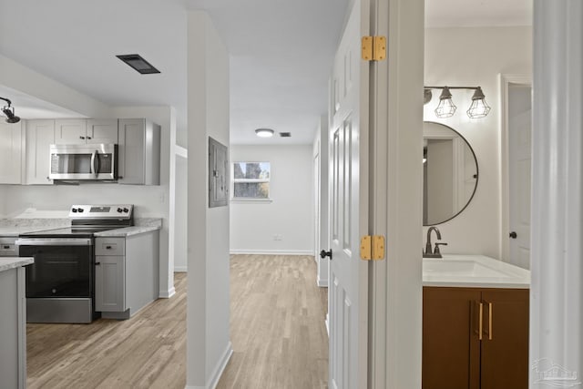 bathroom with hardwood / wood-style floors and vanity