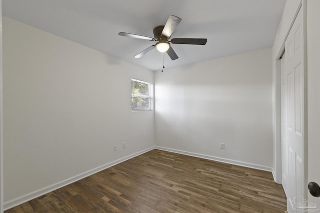 empty room featuring dark hardwood / wood-style floors and ceiling fan