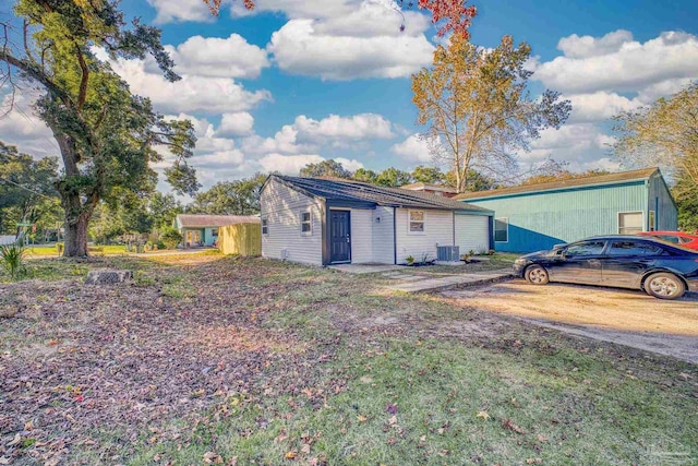 single story home featuring central air condition unit