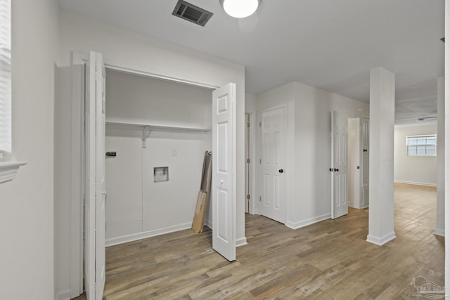 washroom with washer hookup and hardwood / wood-style flooring