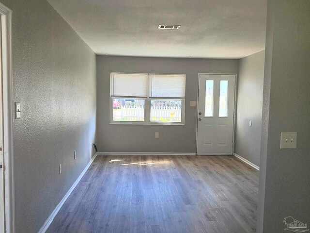 entryway with hardwood / wood-style flooring