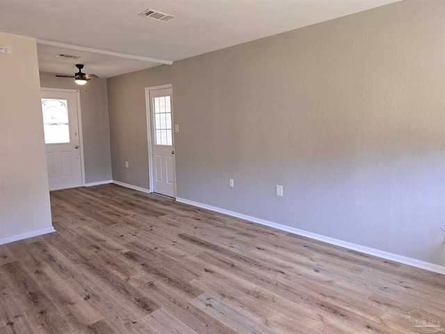 unfurnished room with ceiling fan and light hardwood / wood-style flooring