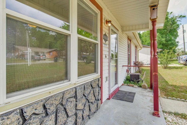 7035 Moore Ave, Pensacola, FL 32526 - view of patio with cooling unit and a porch