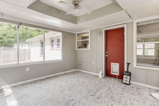 7035 Moore Ave, Pensacola, FL 32526 - spare room featuring a wealth of natural light, baseboards, a ceiling fan, and marble finish floor