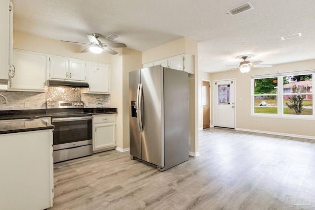 7035 Moore Ave, Pensacola, FL 32526 - kitchen with under cabinet range hood, appliances with stainless steel finishes, ceiling fan, and a sink