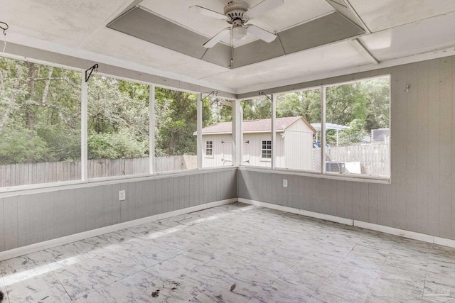 7035 Moore Ave, Pensacola, FL 32526 - unfurnished sunroom with a ceiling fan