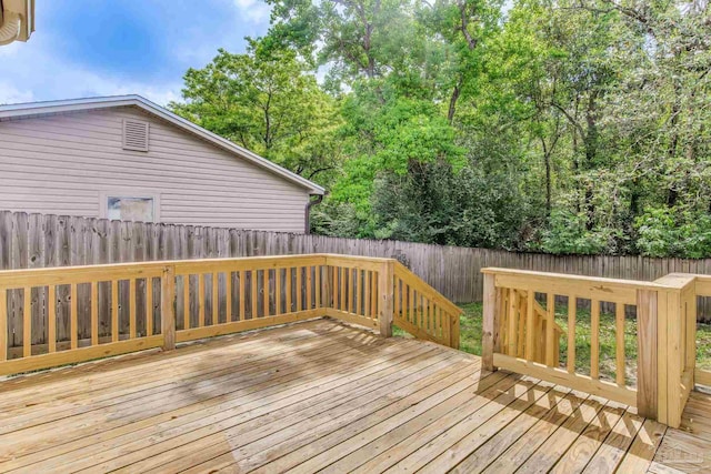 7035 Moore Ave, Pensacola, FL 32526 - wooden deck with a fenced backyard
