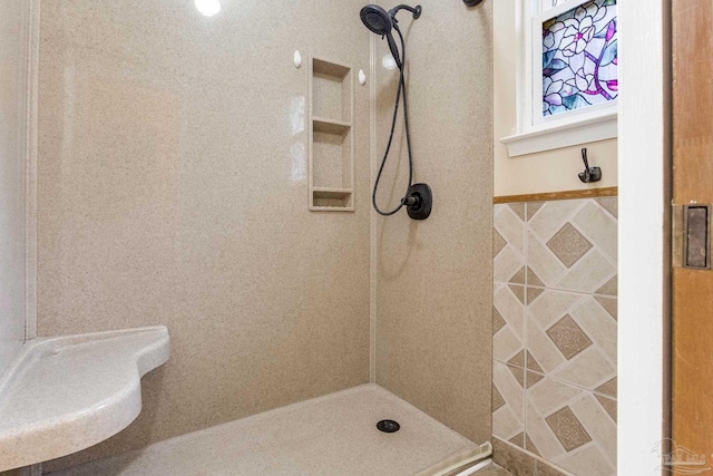 7035 Moore Ave, Pensacola, FL 32526 - bathroom featuring a tile shower