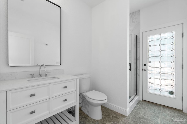 bathroom with vanity, walk in shower, and toilet