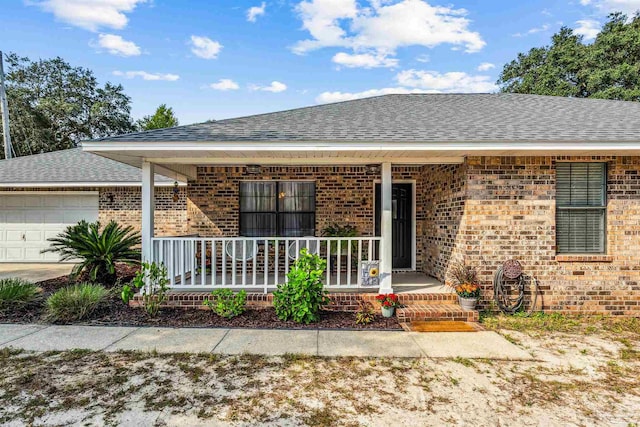 view of front of house featuring covered porch and a garage